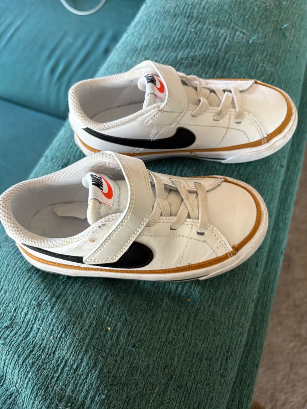 Nike Kids White Sneakers with Black Swoosh and Tan Accent